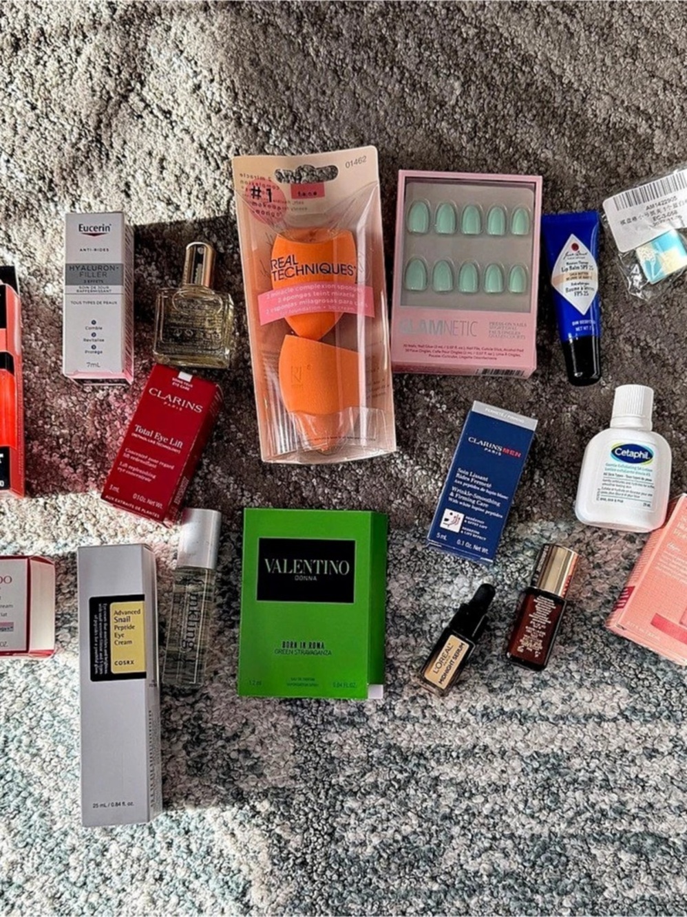 Variety of sample size and full size beauty products and tools